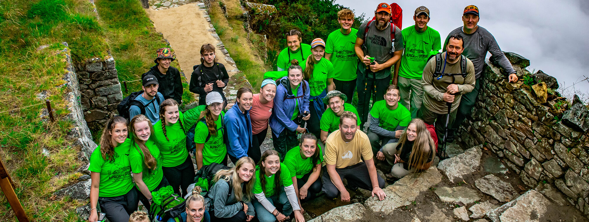 Group poses with ruins on Choquequirao Trek
