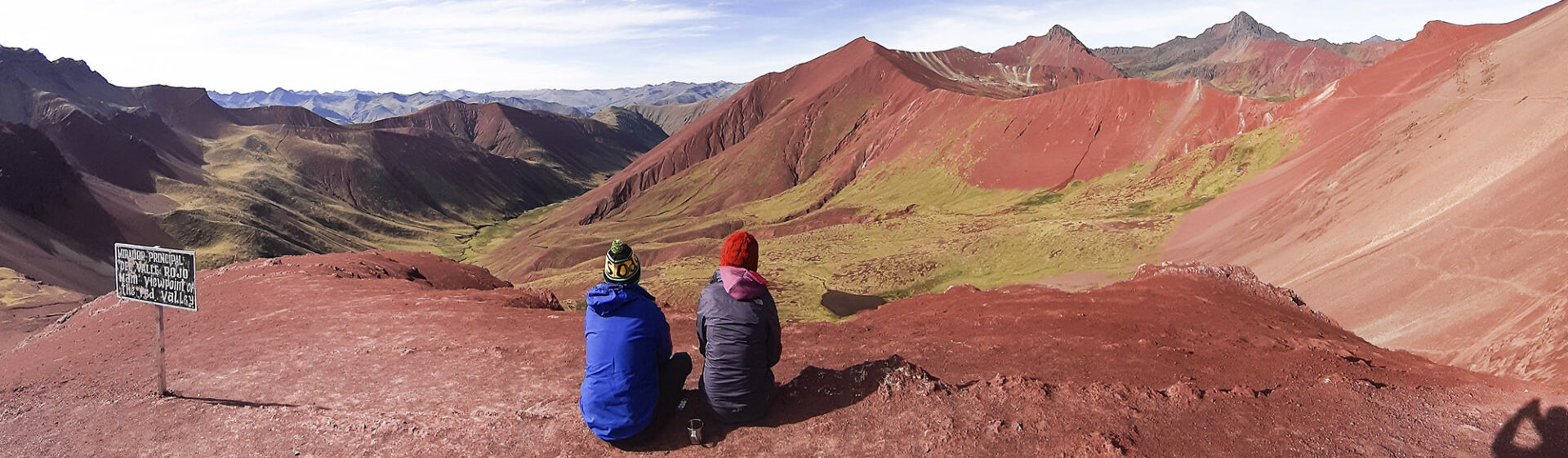 Two trekkers enjoy Red Valley after a Rainbow Mountain Tour