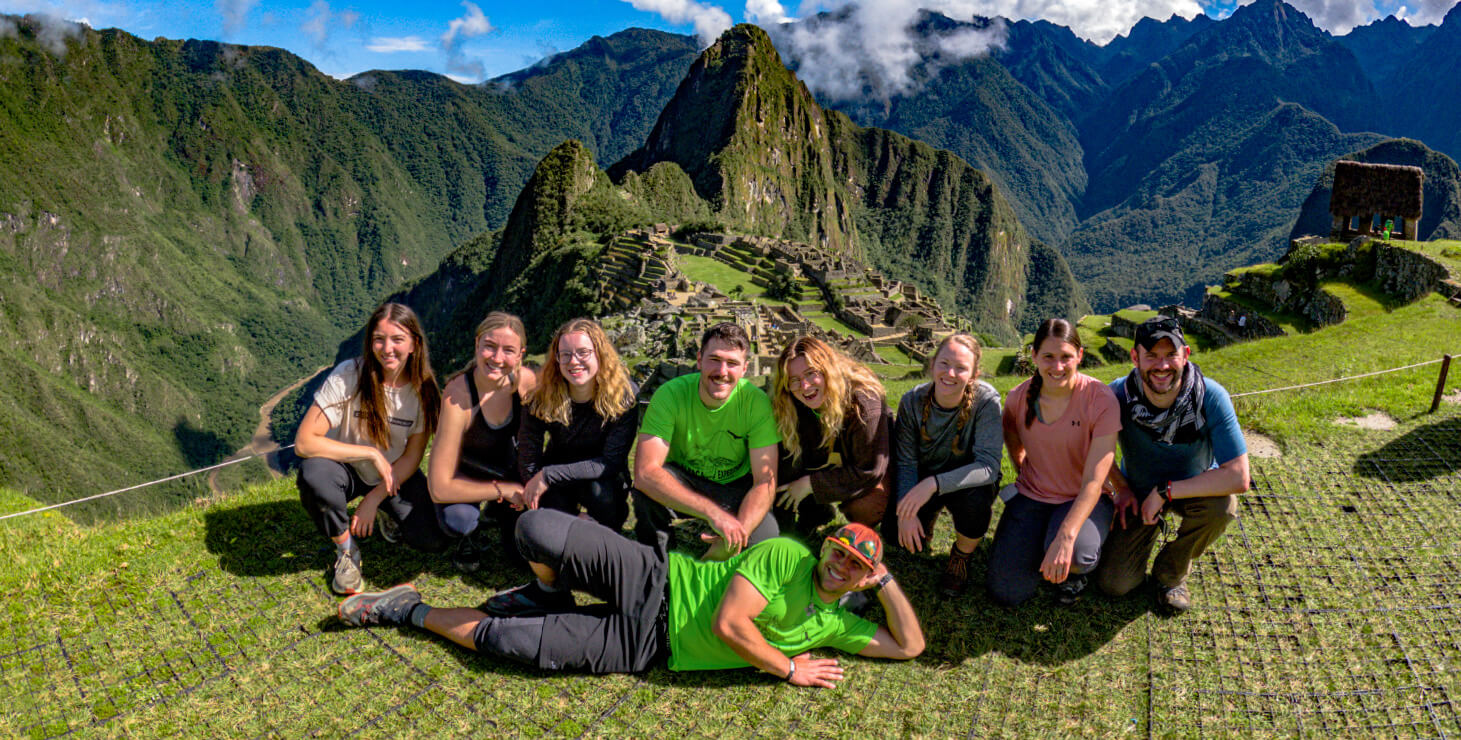 Group posing in front of Machu Picchu on the Choquequirao Machu Picchu Trek