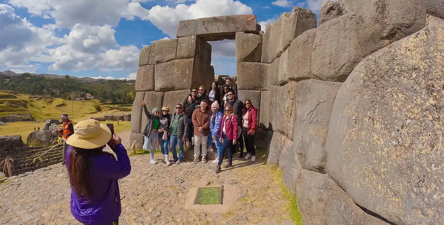 Group visiting Sacsayhuaman in Cusco