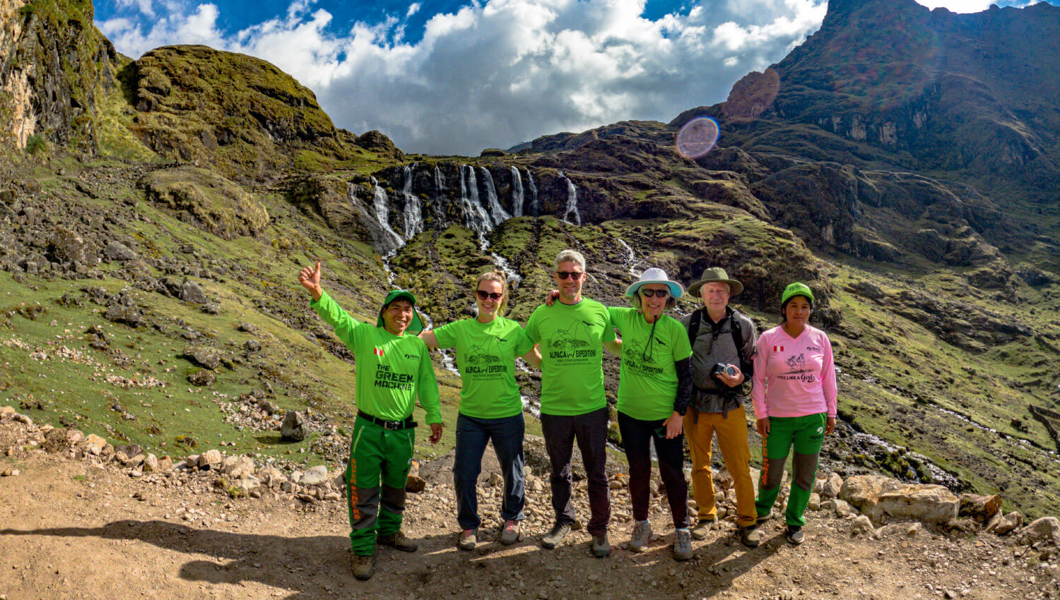 Group enjoying waterfall views on the Lares Trek to Machu Picchu