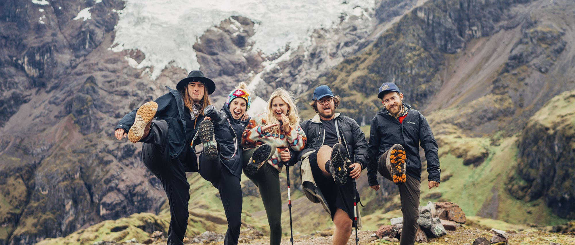 Group of hikers posing with their boots on the Lares Trek to Machu Picchu