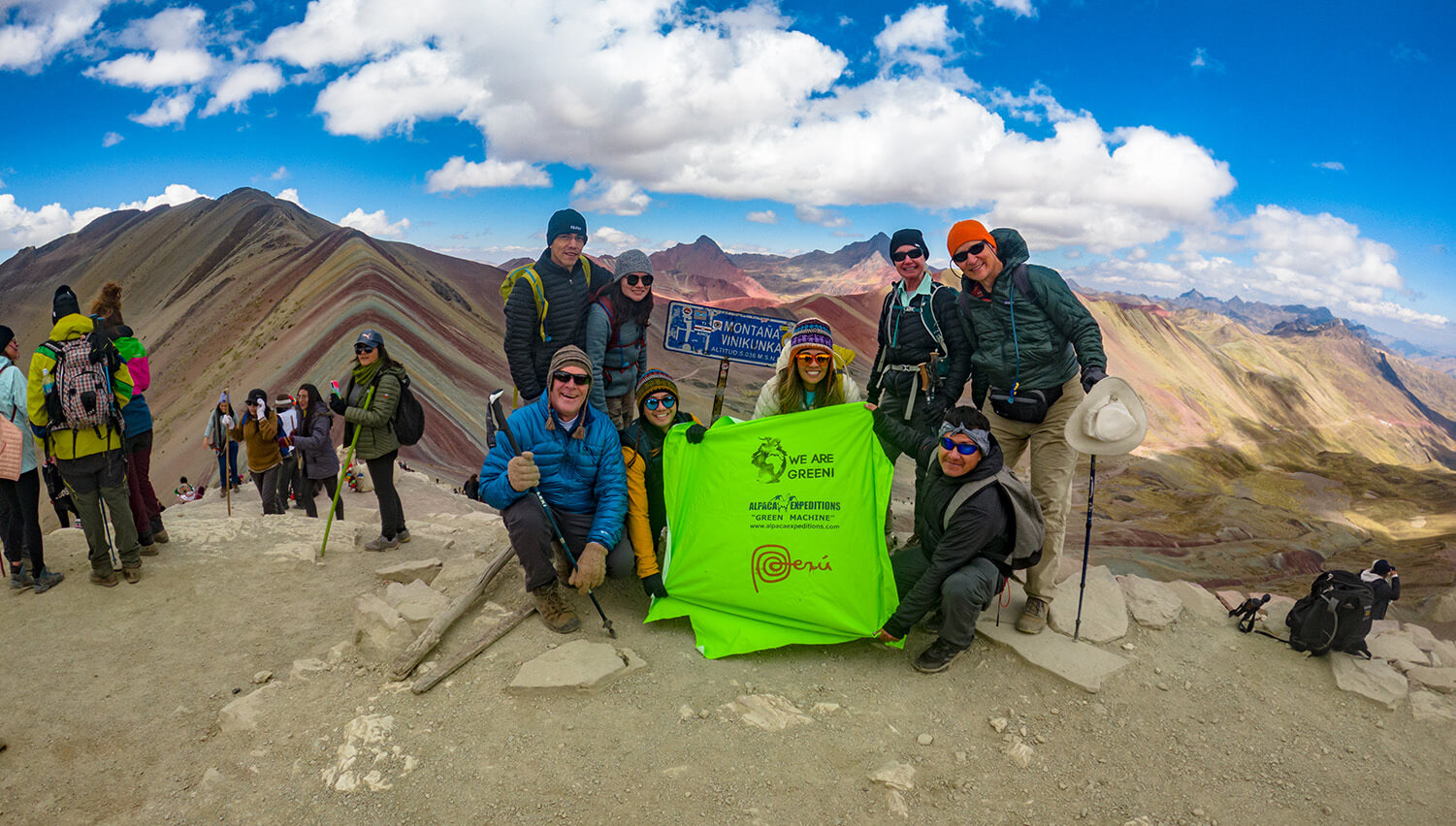 Group Celebrating on the Rainbow Mountain Tour & Red Valley Day Hike