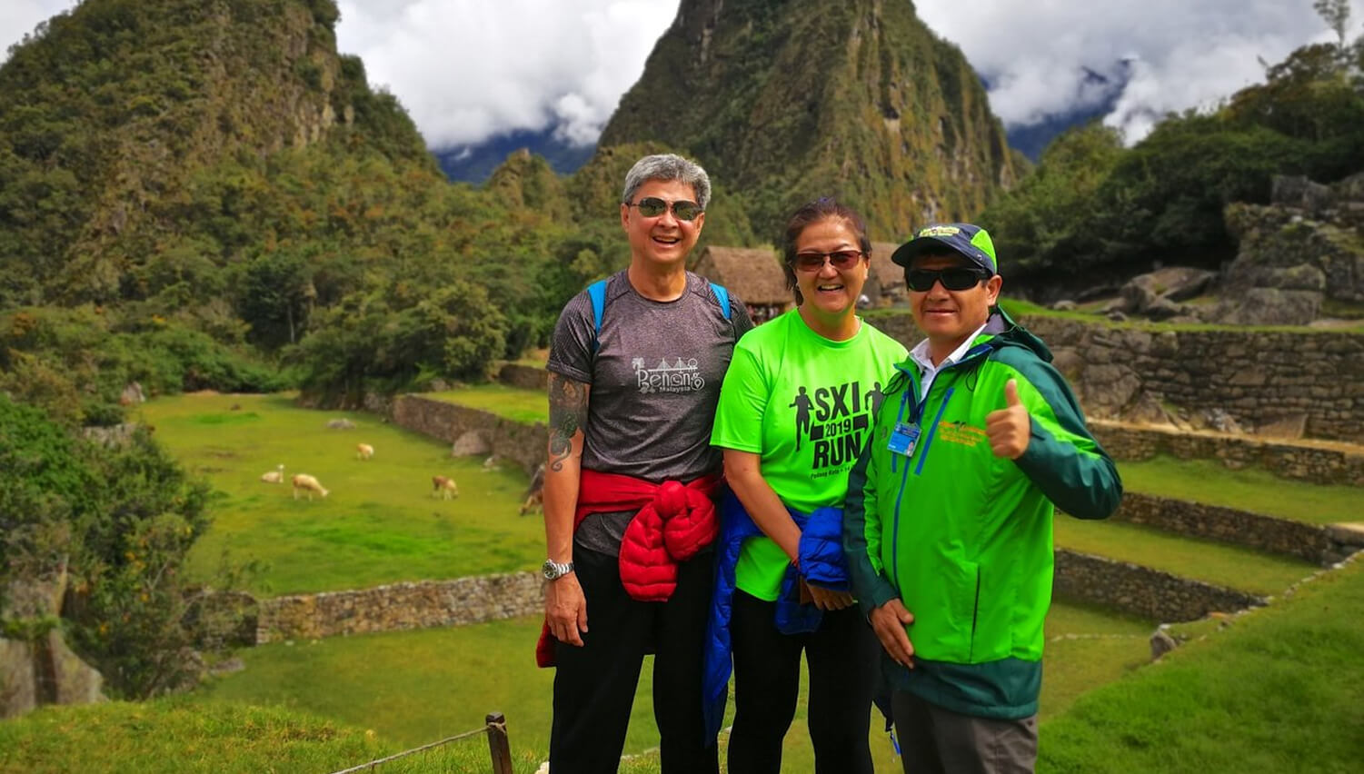 Trio taking in views of ruins on 2-day Inca Trail hike with hotel