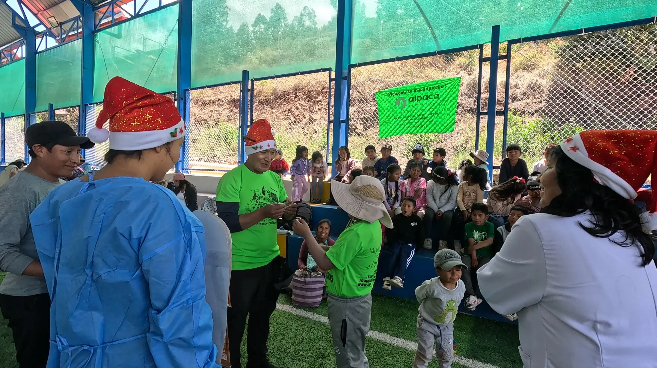 Volunteers from Alpaca Expeditions teaching oral hygiene to children in the Mitmac community.