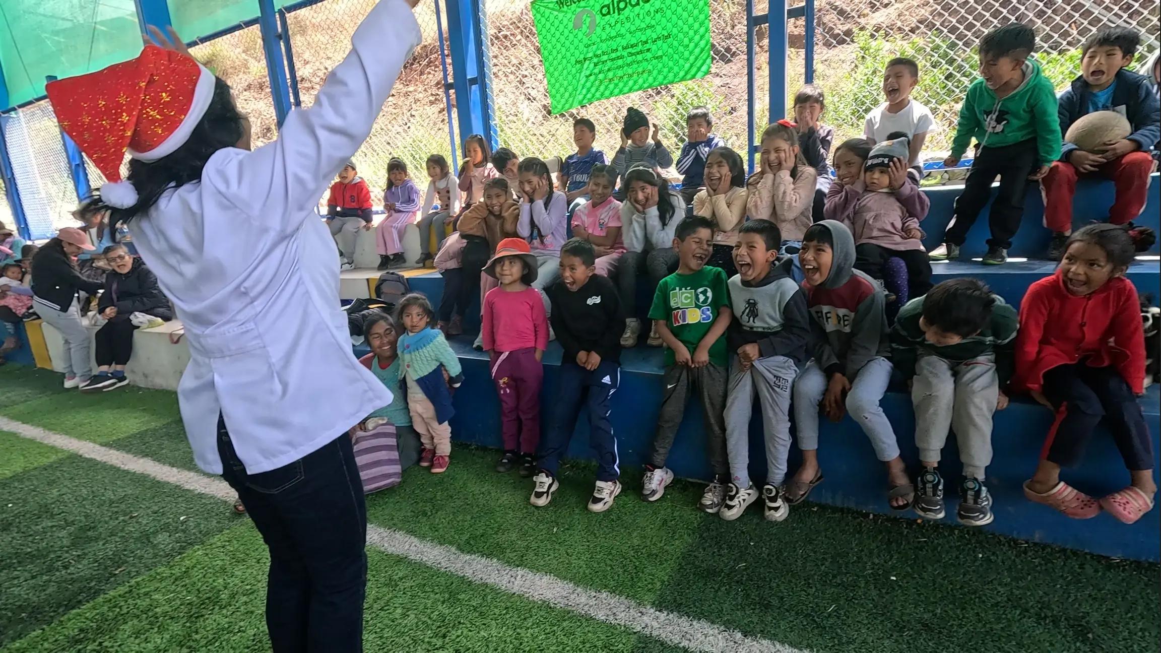 Children from the Mitmac community in Calca participating in Alpaca Expeditions Christmas social project.