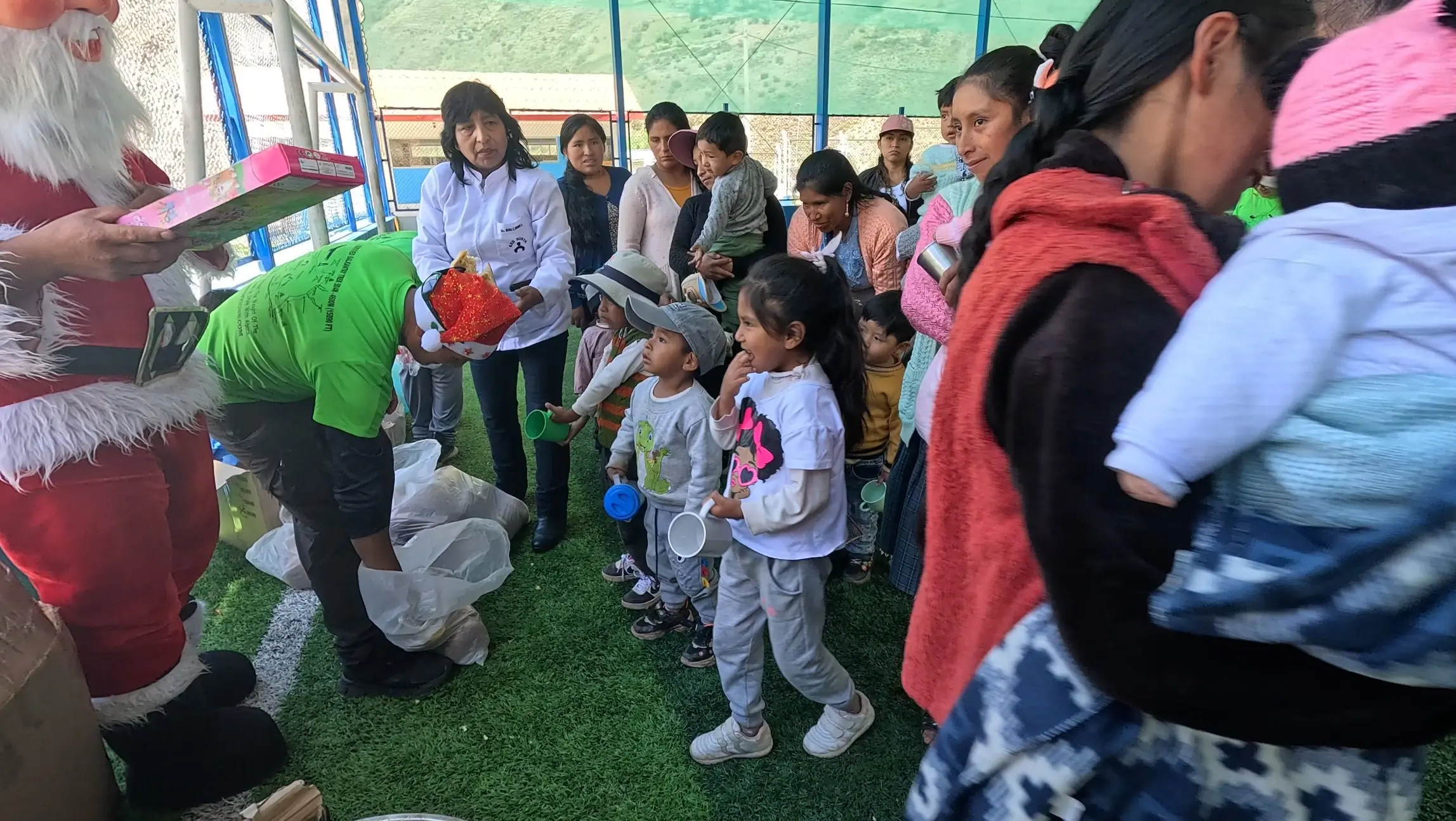 Children smiling during the Christmas social project