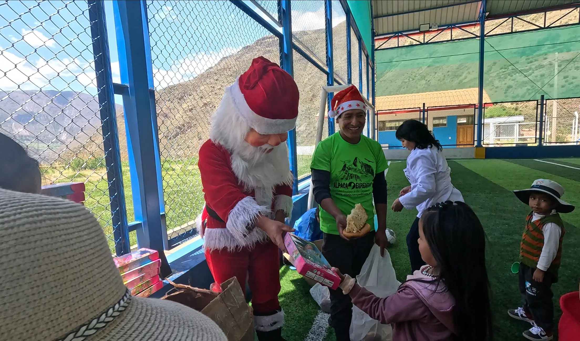 Child receiving toys at Christmas