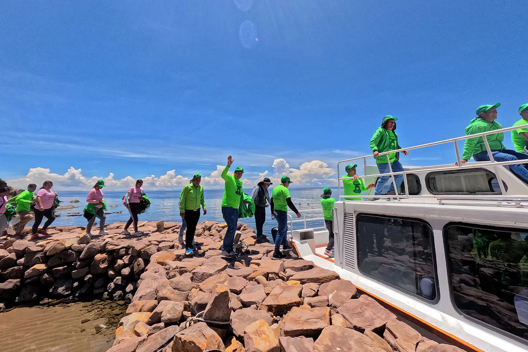 Green Machine team boarding a boat to explore Lake Titicaca during their vacation in Puno.