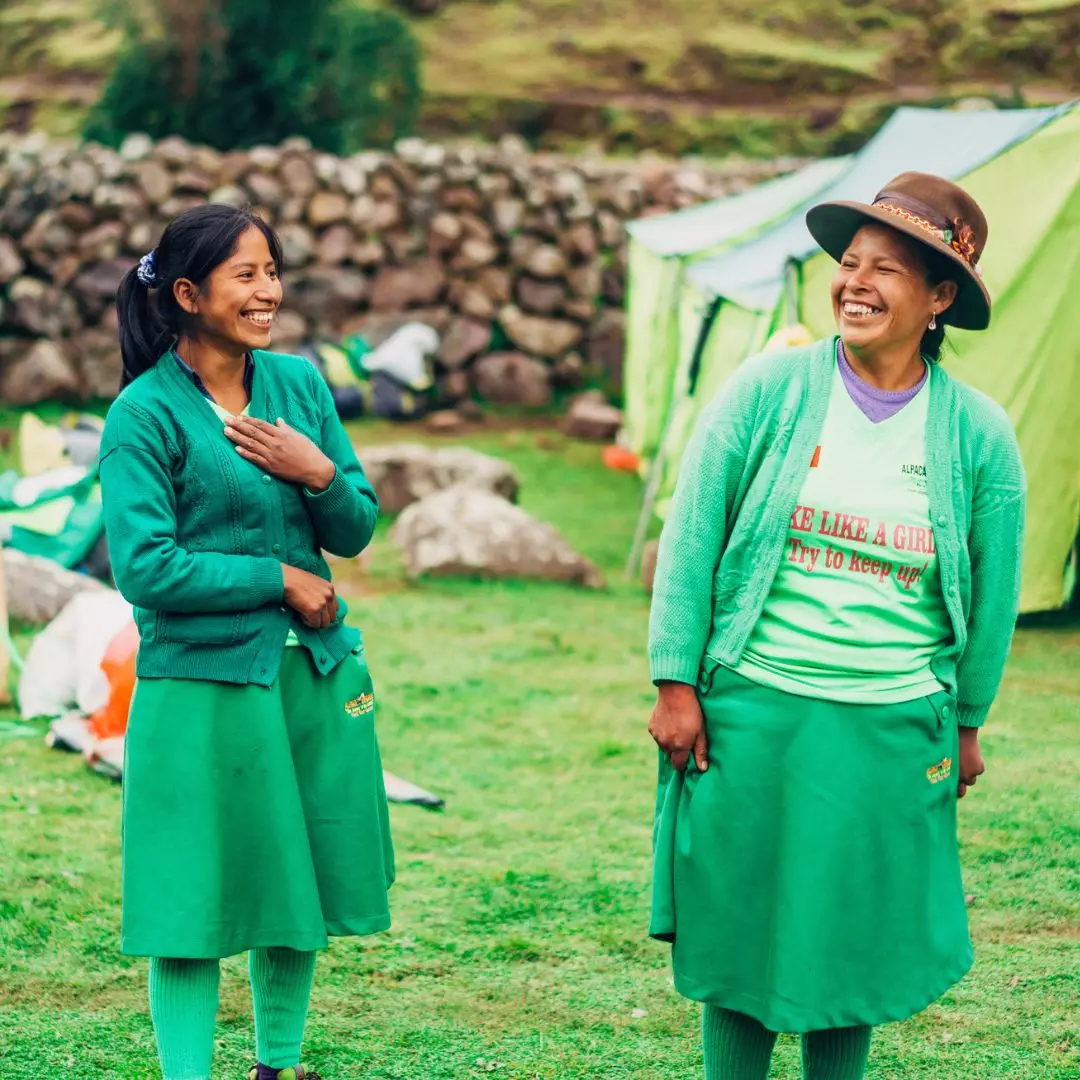 Porters laughing and enjoying time together on the trail with Alpaca Expeditions