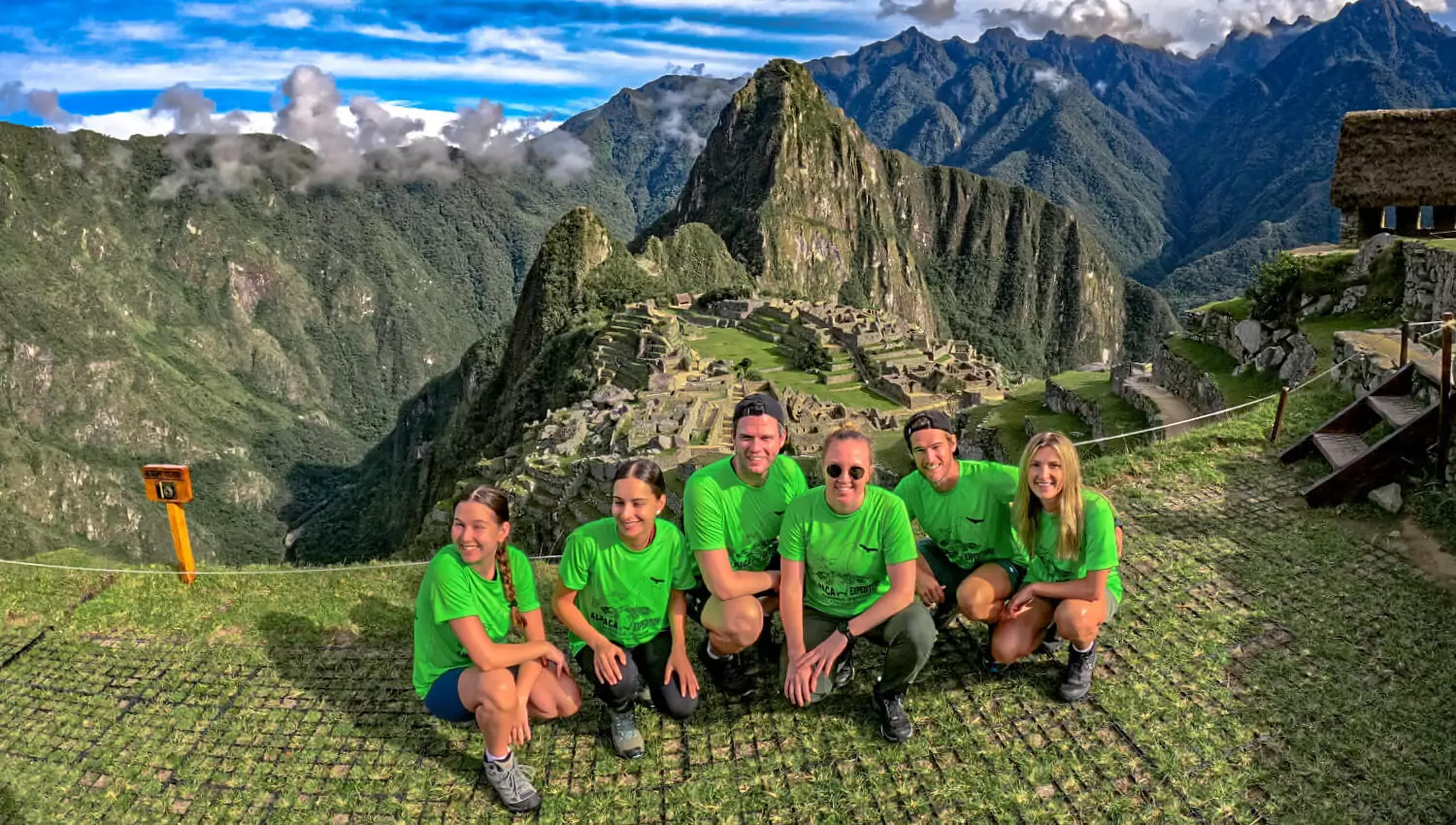 Kids posing in front of Machu Picchu on the Lares Trek